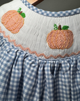 Load image into Gallery viewer, Blue checkered dress with embroidered pumpkins on a gray background