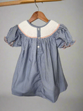 Load image into Gallery viewer, Blue checkered dress with white collar on a wooden hanger against a neutral background