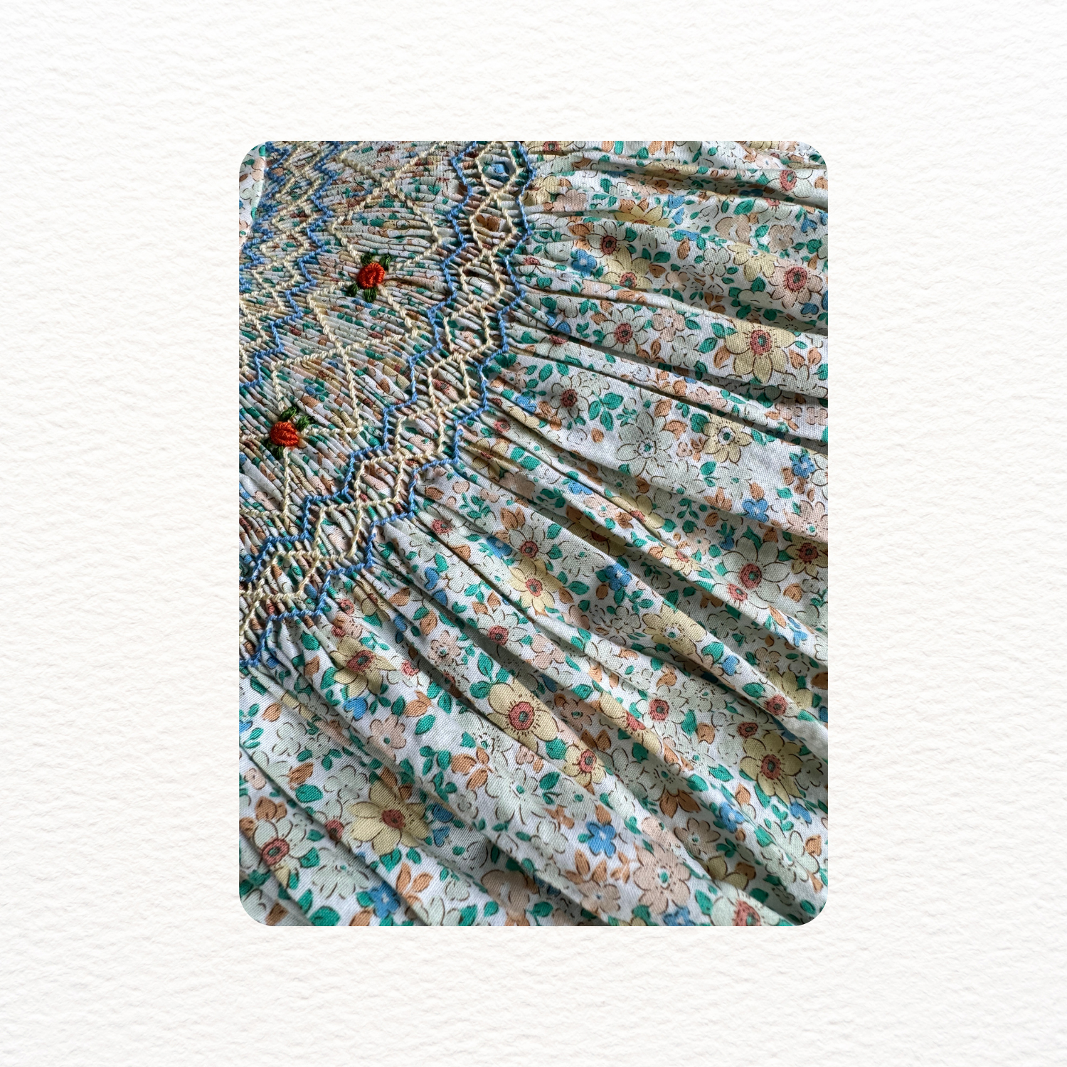 Floral patterned fabric with embroidery on a white background