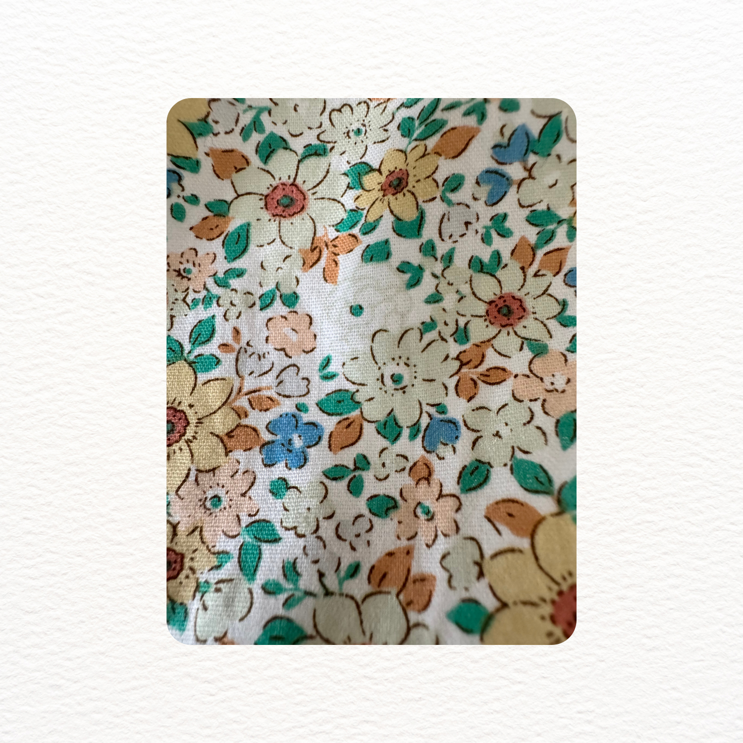 Floral patterned fabric swatch on a white background